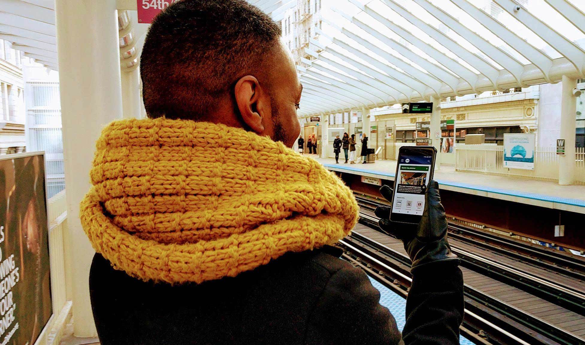 A person looking at the new website at Washington/Wabash