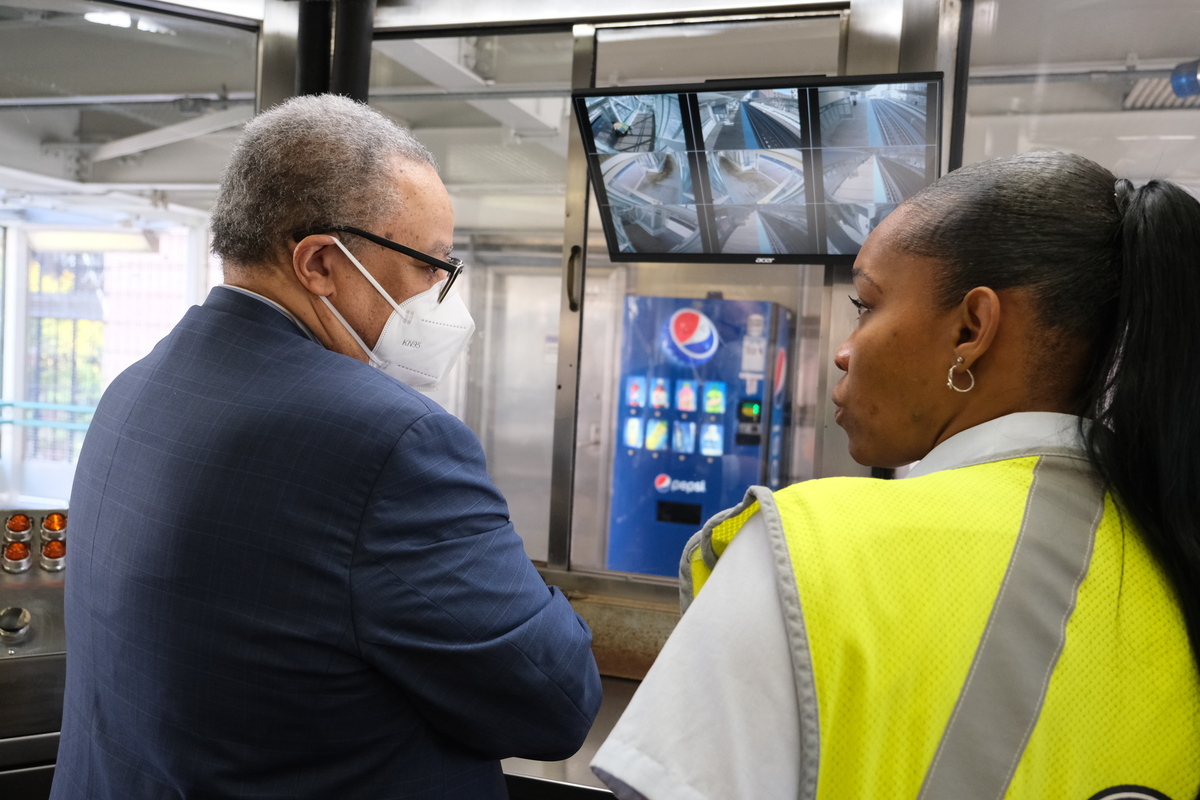 CTA President Carter is shown one of the new security camera monitors installed in a CA booth at the Clinton Green Line station.