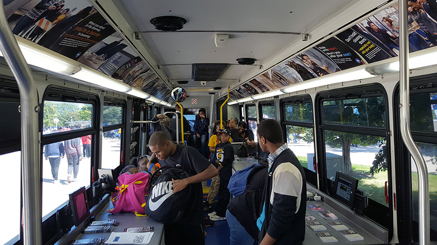 Visitors of Community Connection enjoying the A/C and games, while picking up new service information.