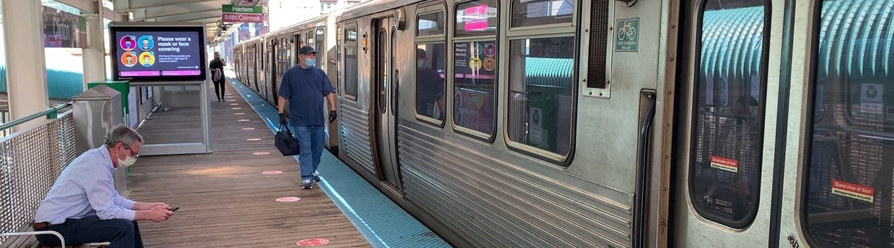 Customers on platform with Pink Line train