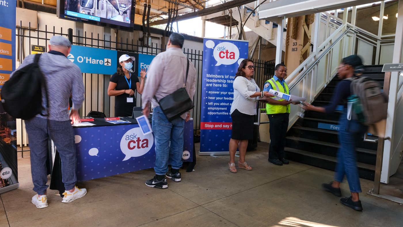 Customers stop by and chat with managers staffing first "Ask CTA" event at California Blue Line