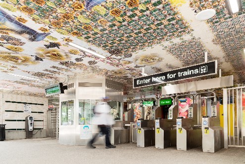Interior view of the in-service Garfield Green Line station house featuring artistic architectural embellishments by artist Nick Cave.