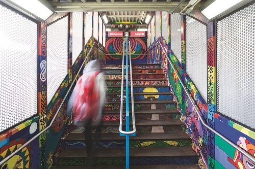 L station staircase with mural