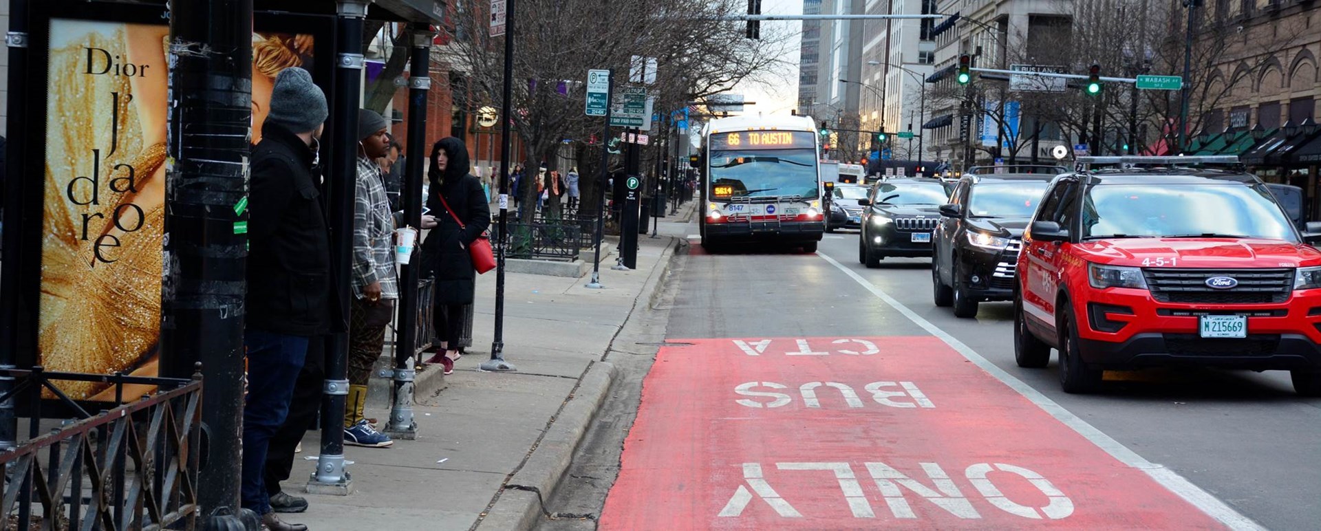 A #66 Chicago bus traveling in a bus only lane. 