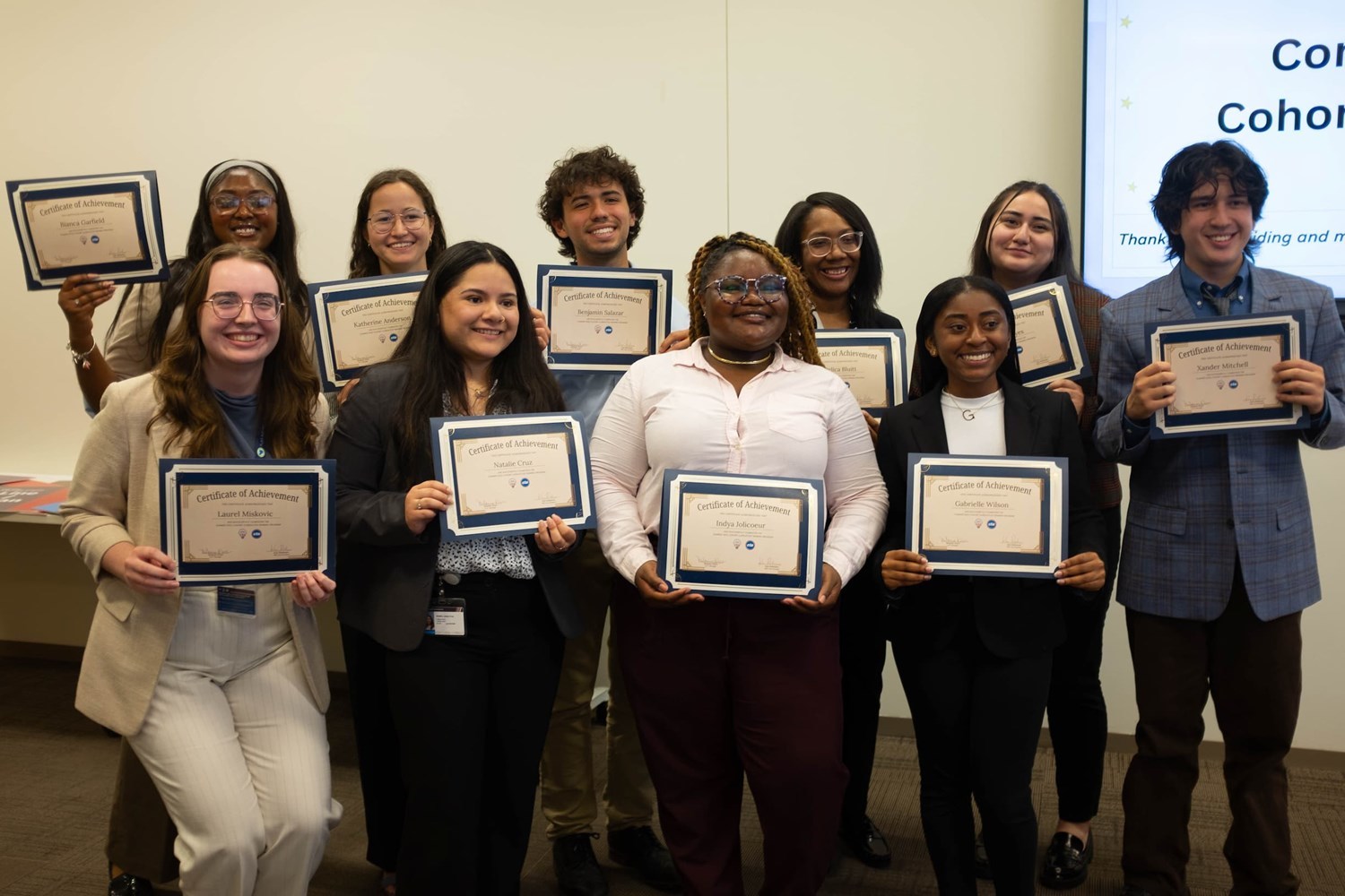 Interns holding certificates of achievement