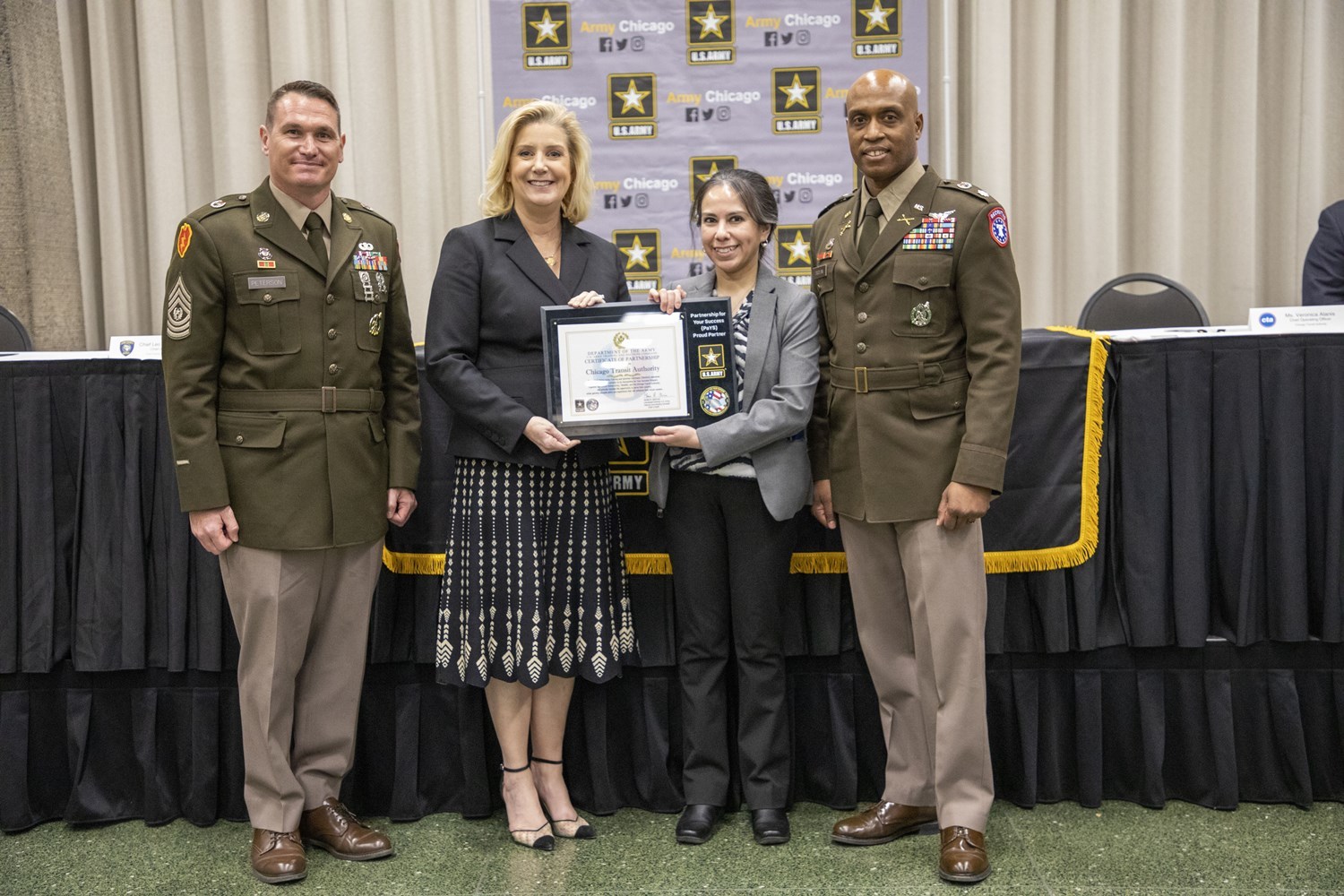 CTA 's Chief Operations Officer Vernoic Alanis joins the Secretary of the Army, Christine Wormuth, at the Army PaYs signing ceremony. 