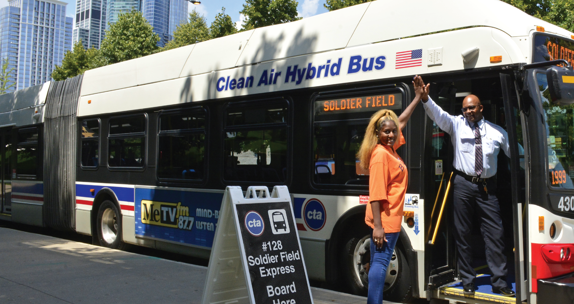 Bus operator high-fiving a rider