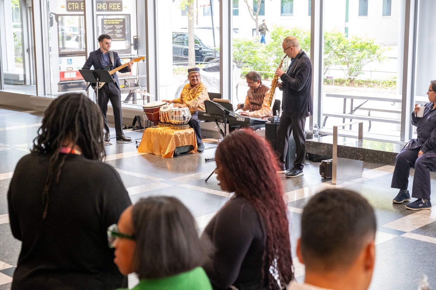 Mandala performing with audience in foreground