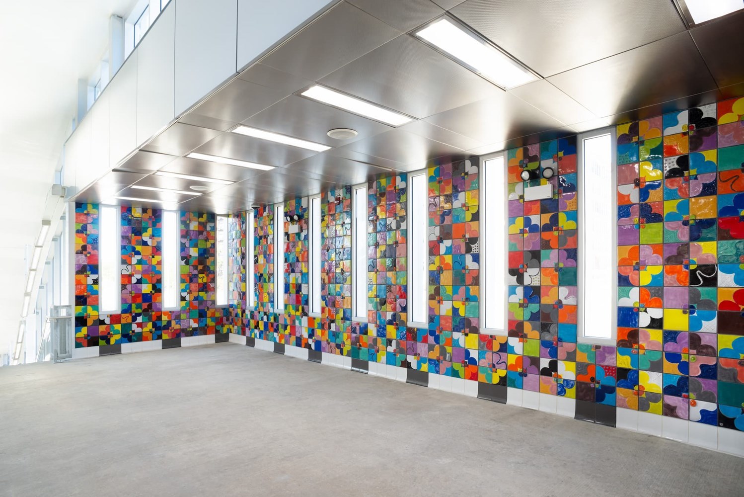 floor-to-ceiling artwork of colorful tiles