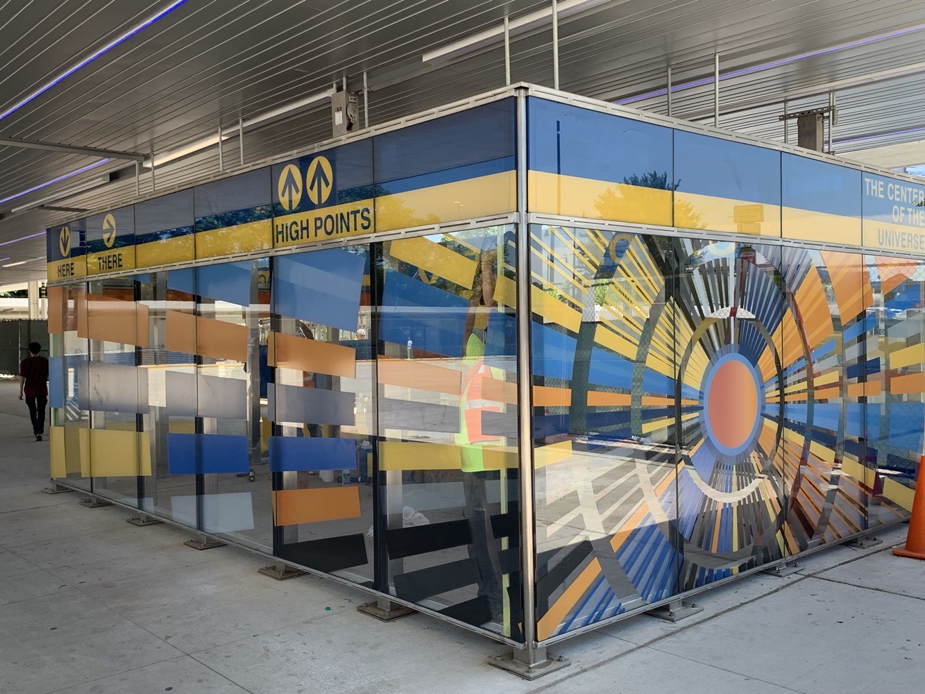 Bus waiting area at Jefferson Park featuring new art glass installation