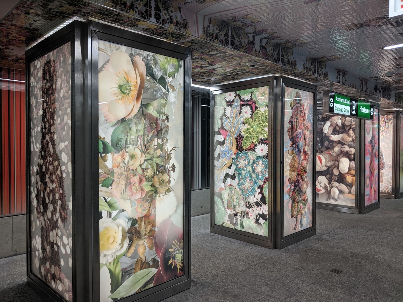 Station interior: Backlit, lenticular columns featuring the artist's multi-disciplinary artwork also known as "Sound Suits" 