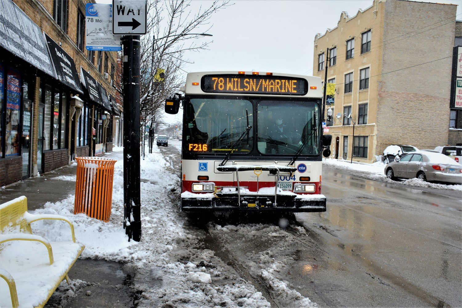 A cleared CTA bus stop along the public way allowing customers to safely board buses. 