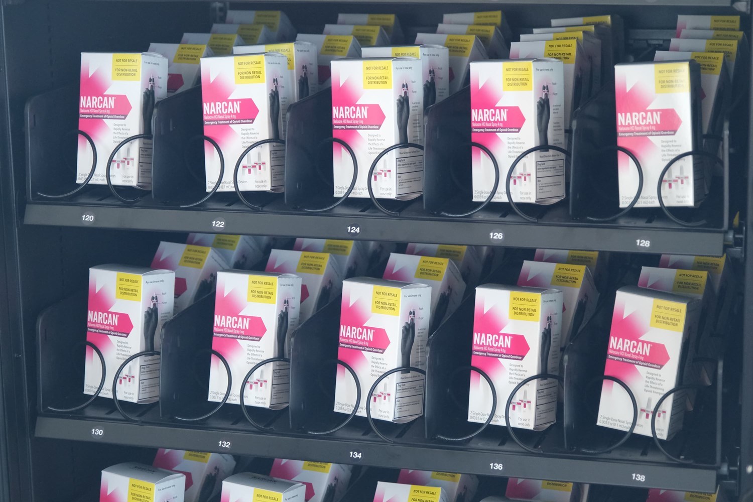 Detail shot of Narcan vending machine showing rows of treatments
