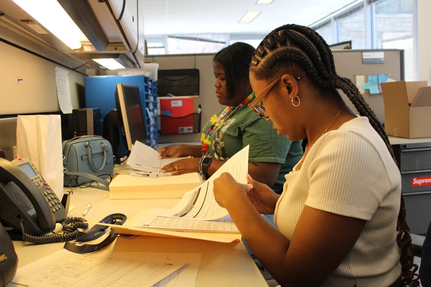 Chicago Youth Works participants working at a desk