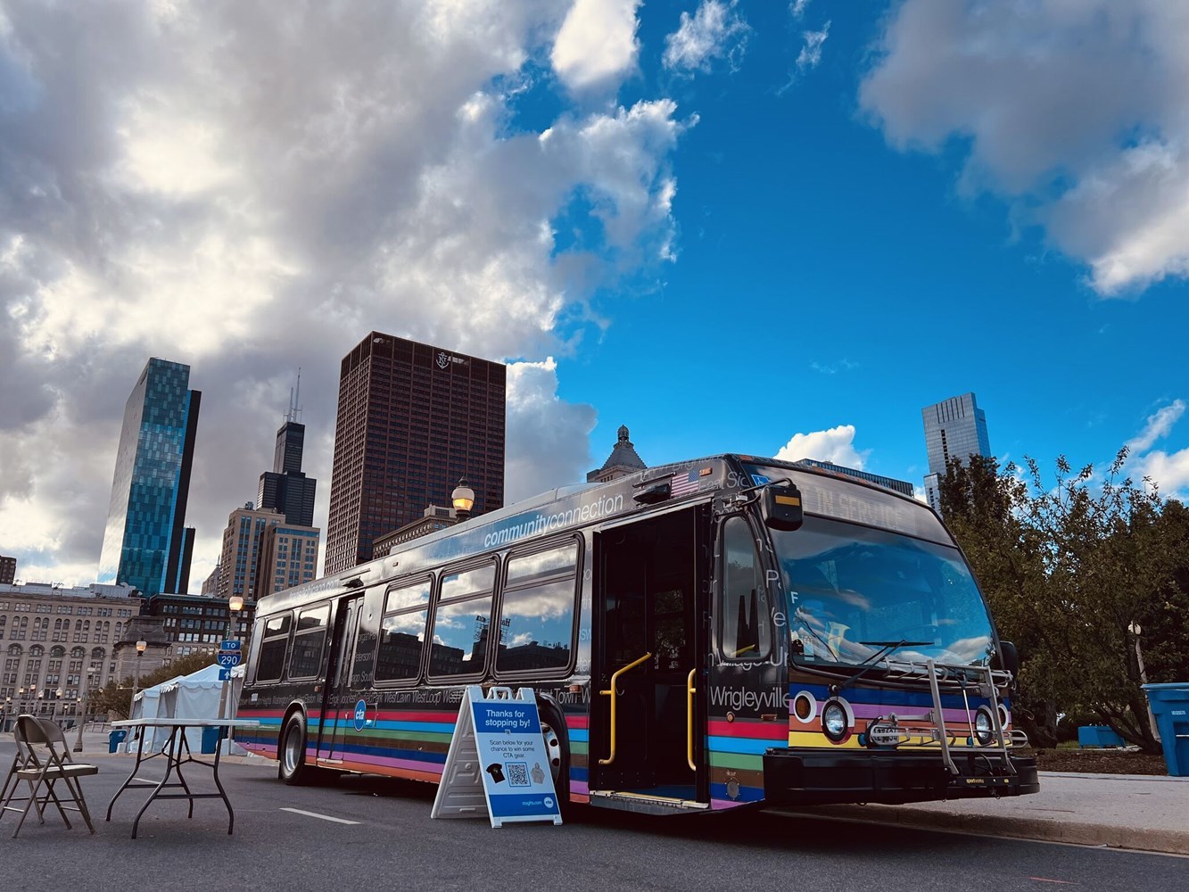 The Community Connection bus under a bright blue sky.