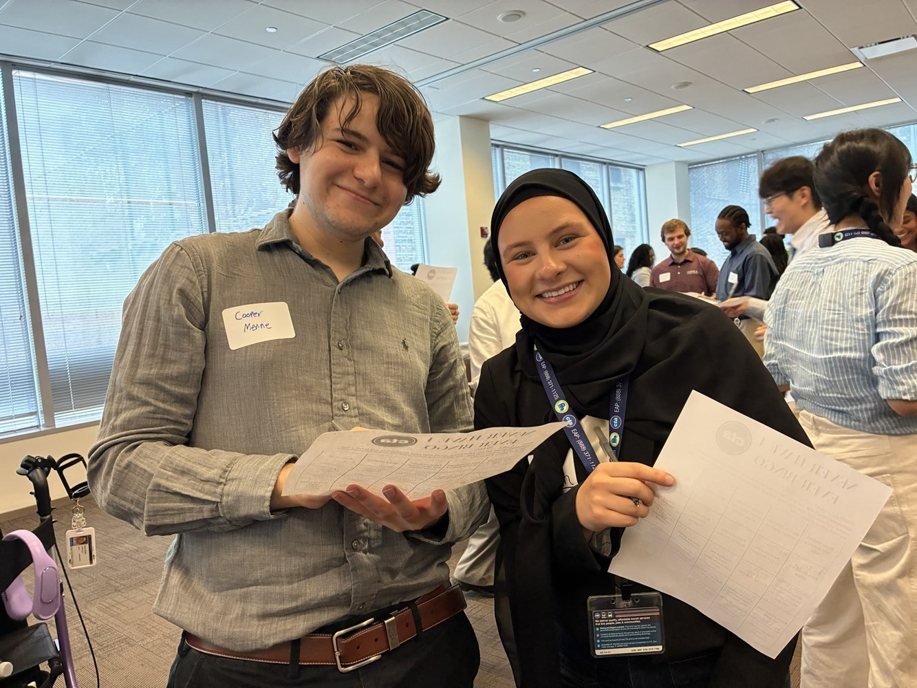 Two interns smiling for the camera