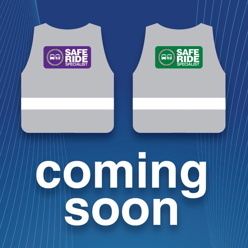 Illustration of wwo vests that say Safe Ride Specialist. One is green and one is purple.