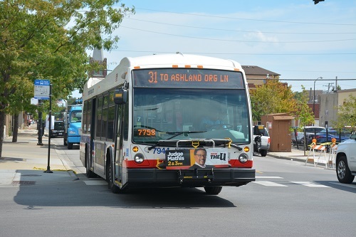 Bus pulling away from a stop