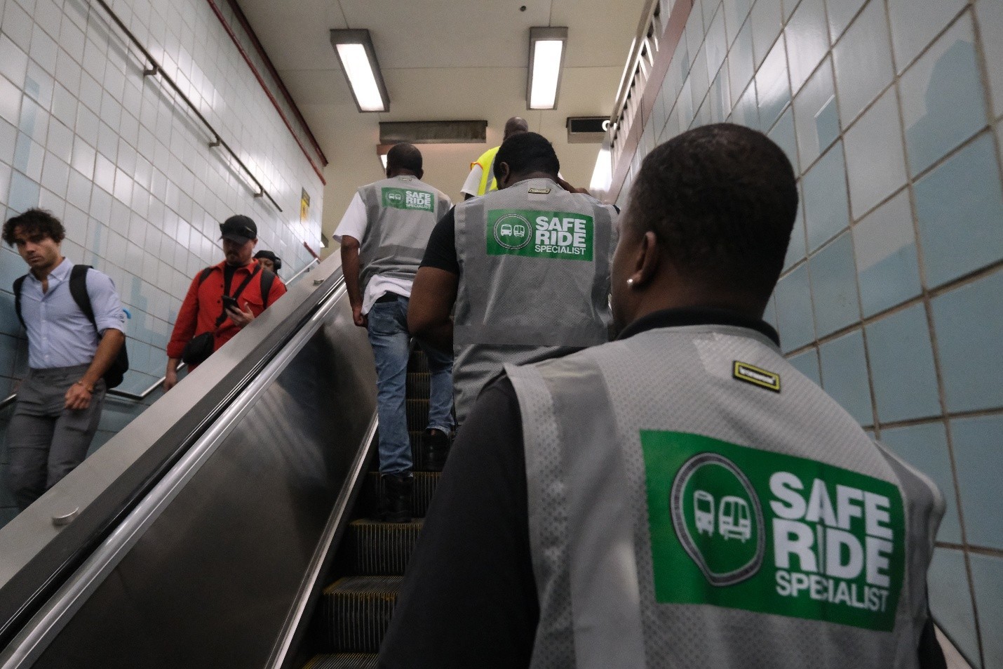 A team of Community Violence Intervention Specialists traveling the Red Line as part of the Safe Ride Specialists Pilot Program
