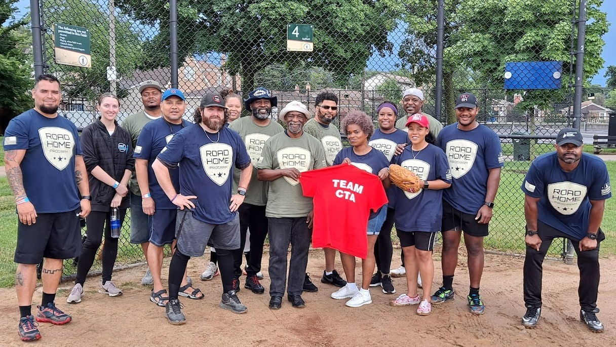 CTA baseball team wearing t-shirts with the Road Home Program logo