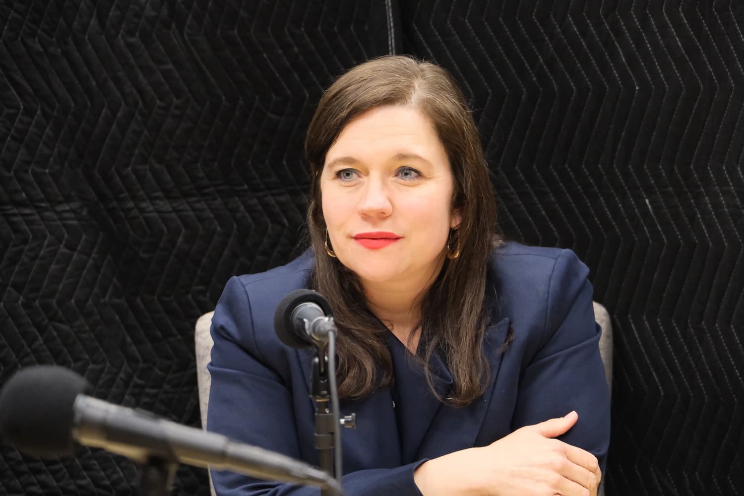 Acting President Nora Leerhson in front of the microphone.
