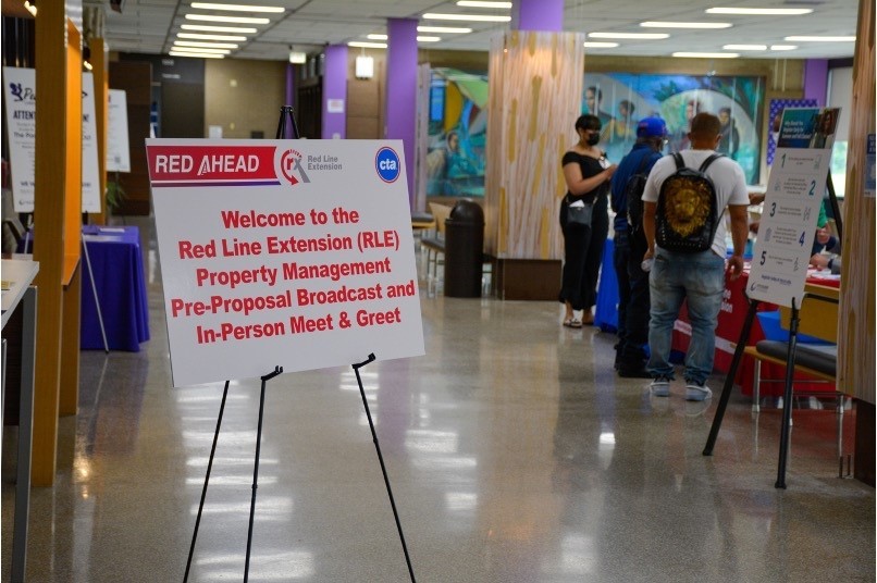 Sign welcoming attendees to the broadcast and in-person meet and greet