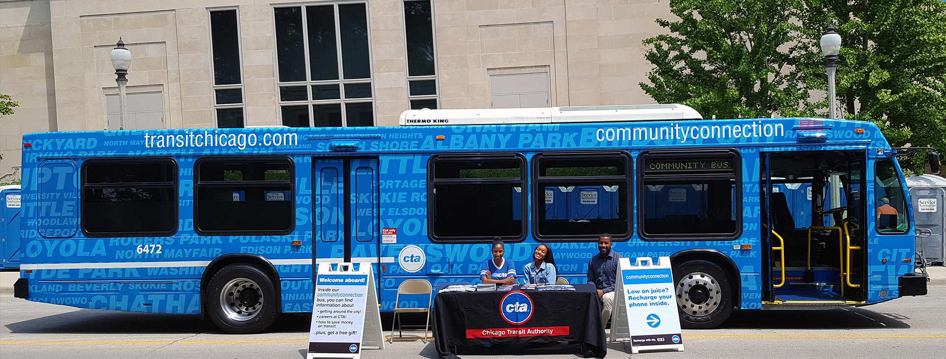 CTA staff waiting to greet riders outside the Community Connection bus