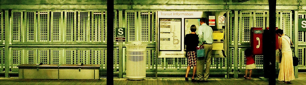 People looking at a map and timetable board