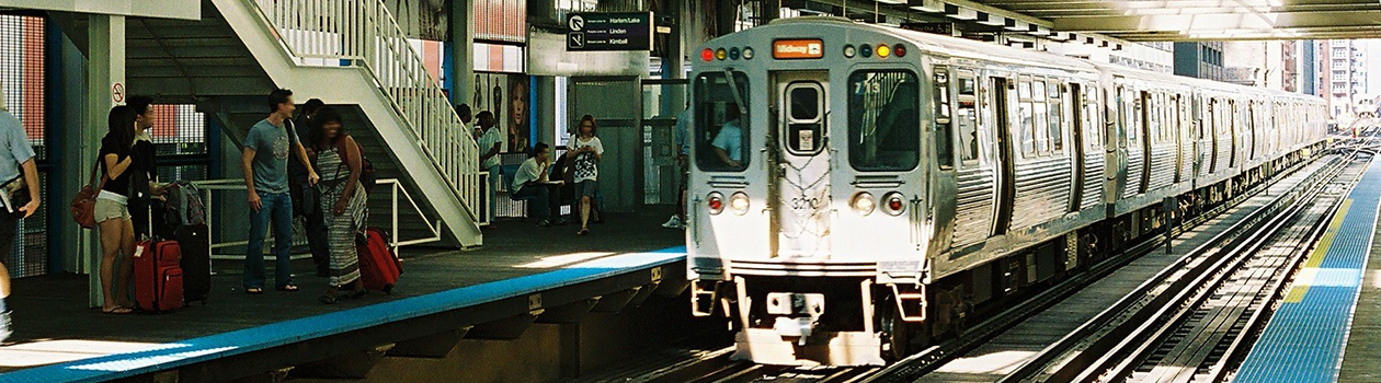 People show excitement as an Orange Line train to Midway enters Clark/Lake